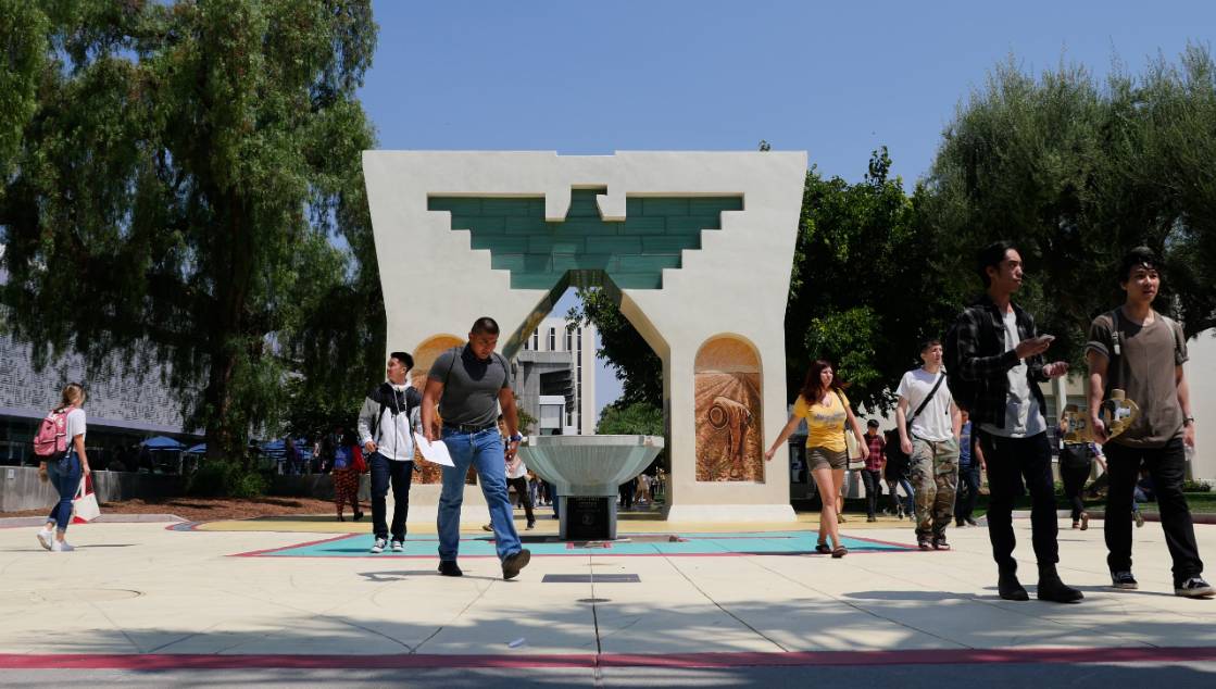 Students walking in front of Caesar Chavez Monement