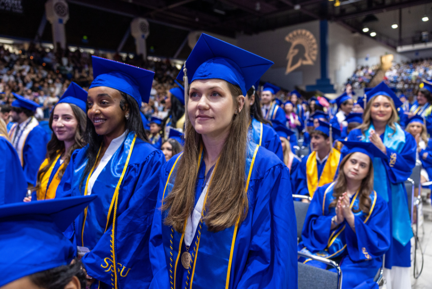 Graduating students in Spartan Blue regalia