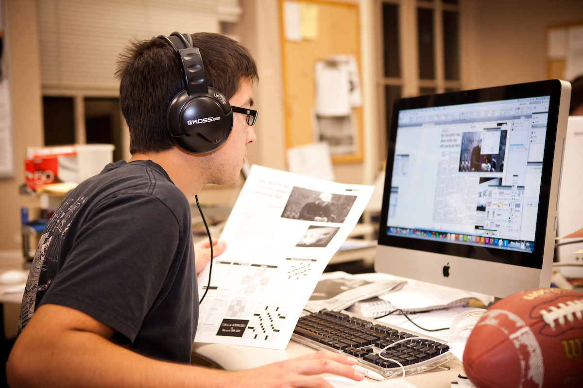 student on phone and computer