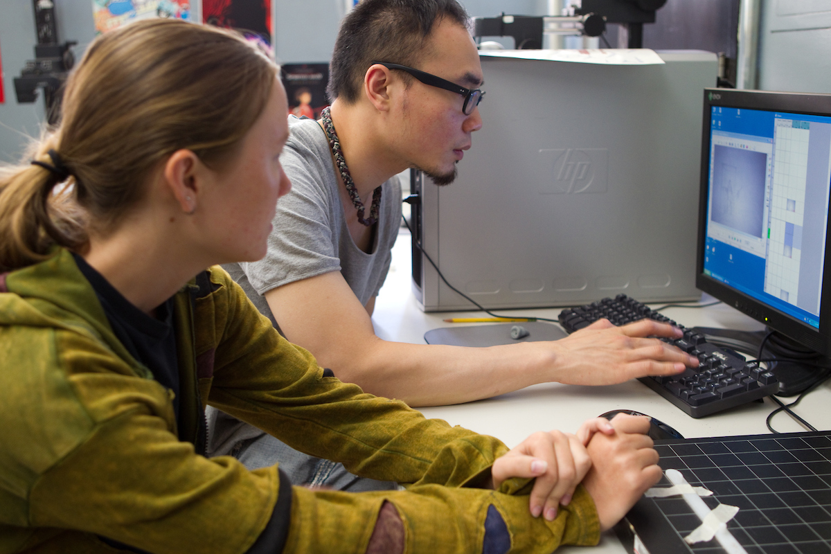 two students with computer