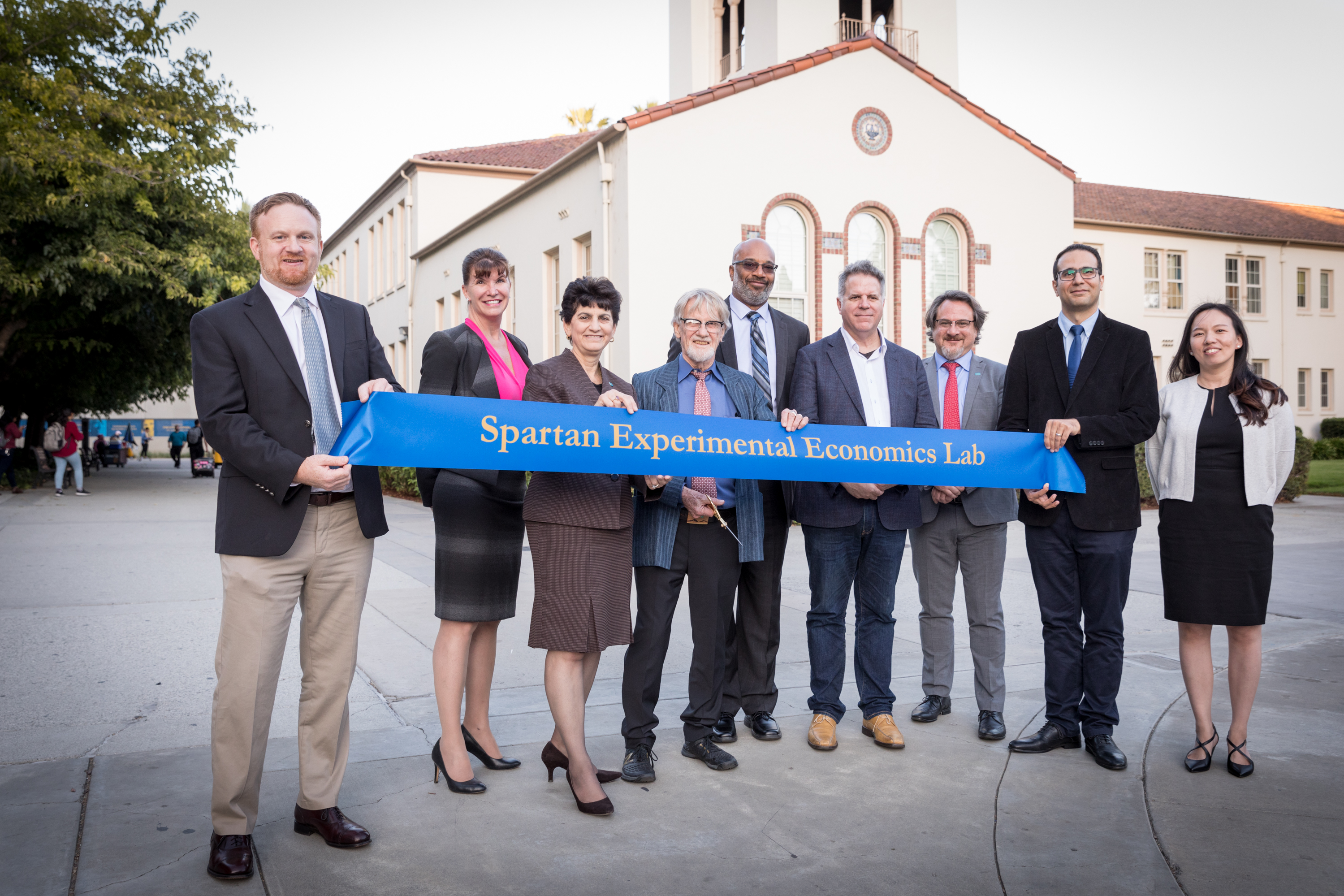 Faculty holding a SEEL banner on the day the lab opened.