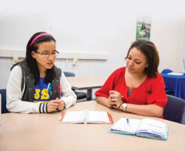 Tutor helping student