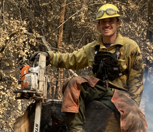 Image of David Cowman, one of Dr. Russell's graduate students, conducting fieldwork in the forests of California.