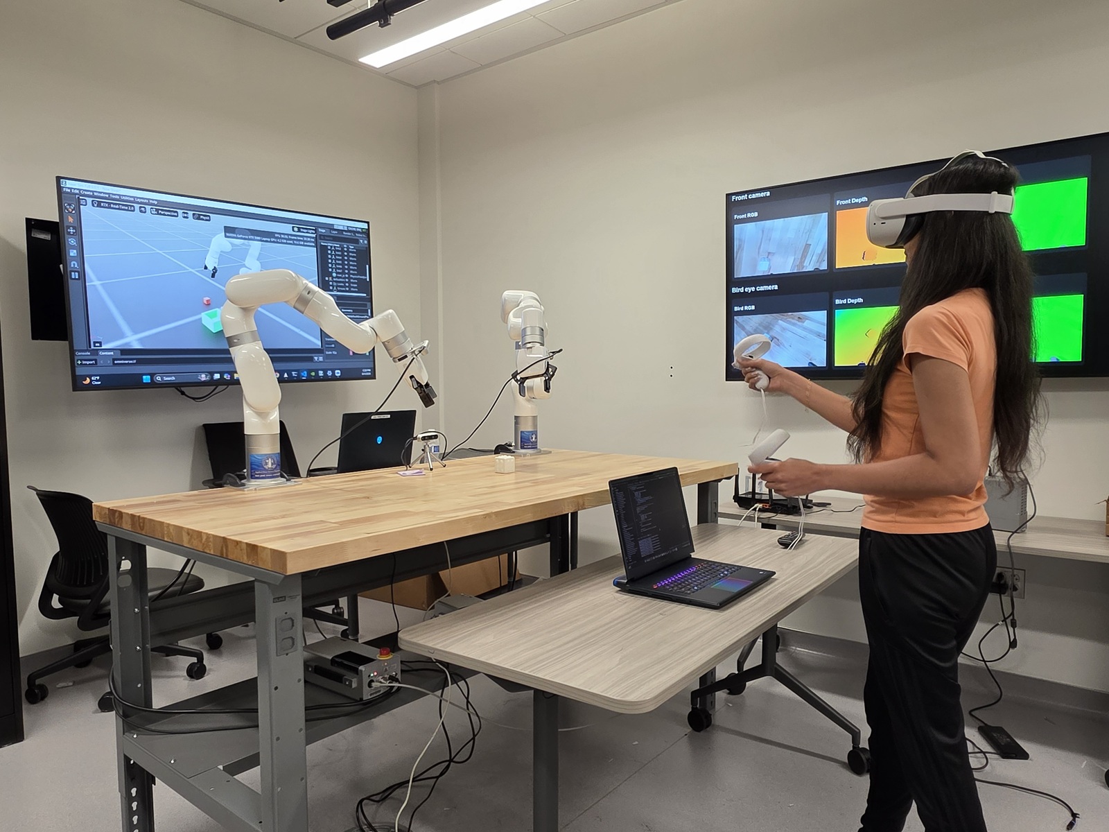 Twin Lab student with robotic arm Twin Lab student with robotic arm
