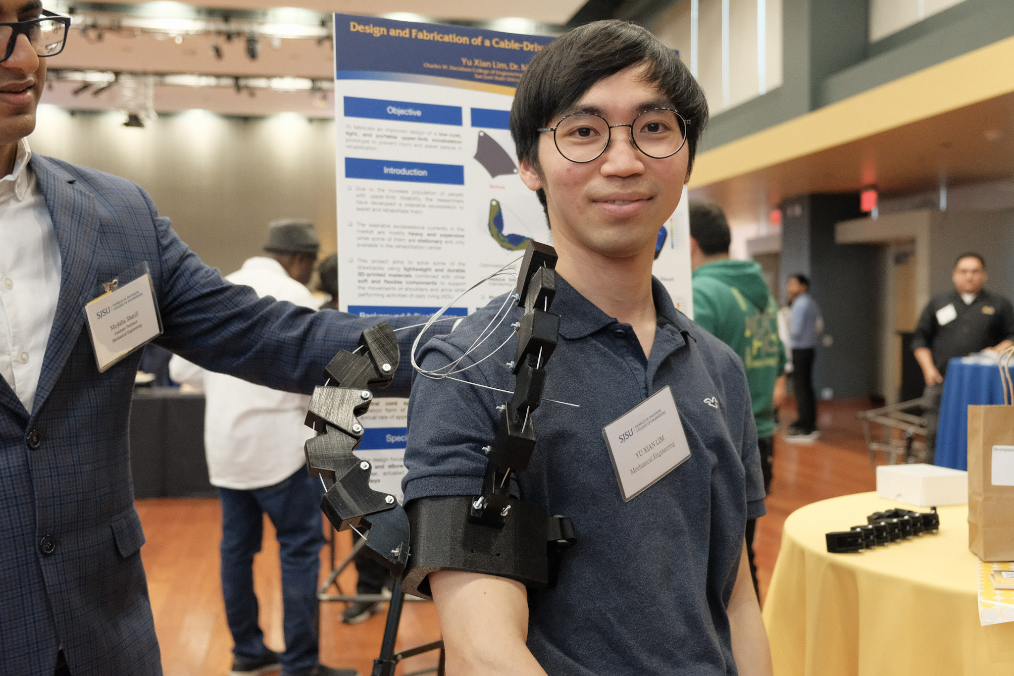 Student demonstrating the Upper Limb Exoskeleton