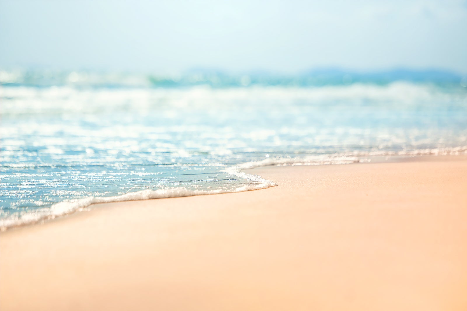 Surf washing on the sand 