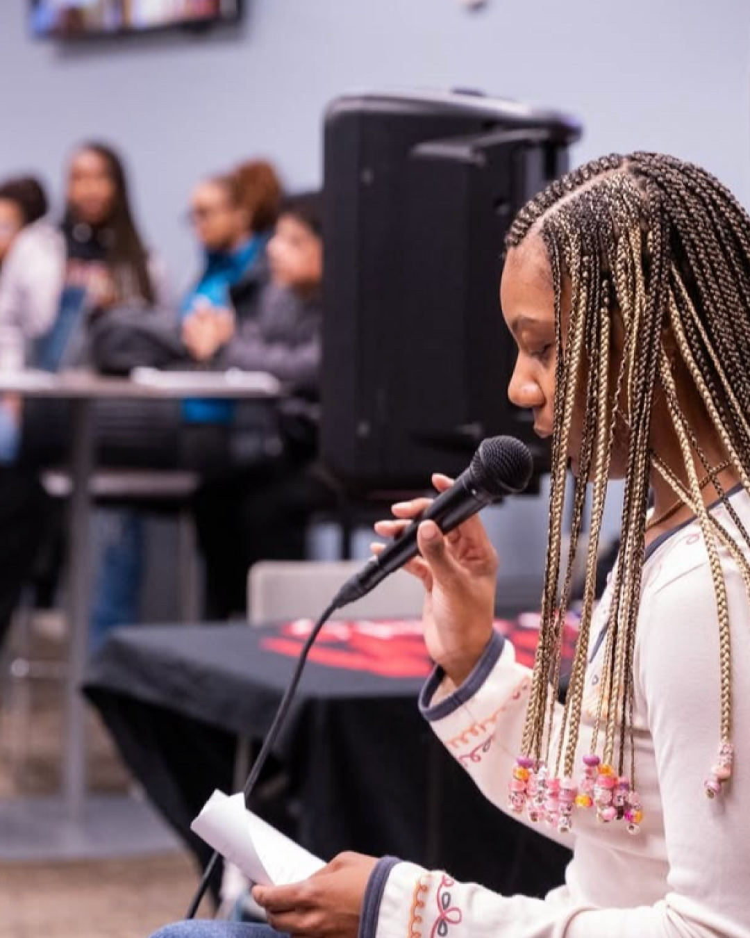 student performing at open mic