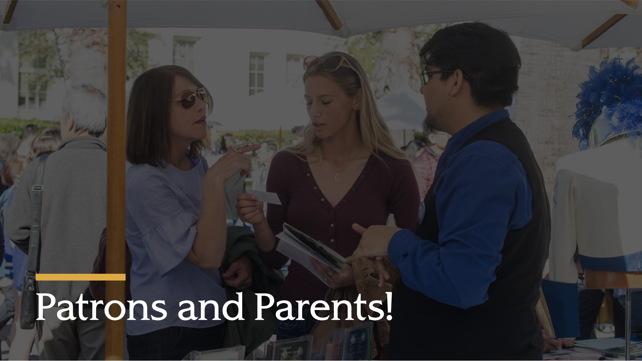 Group of three patrons and parents talking.