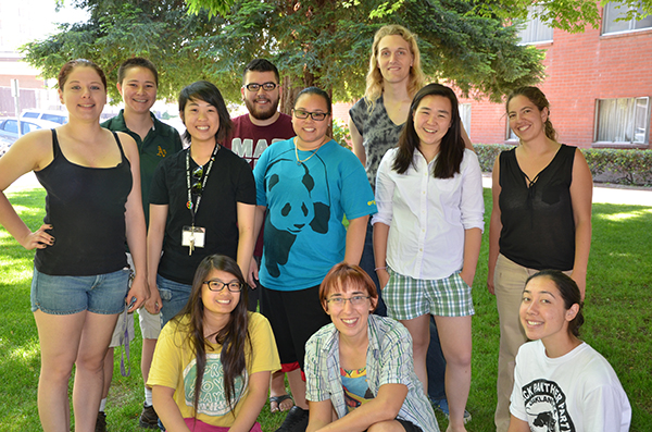 Photo of a group of Peers in Pride students standing outside.