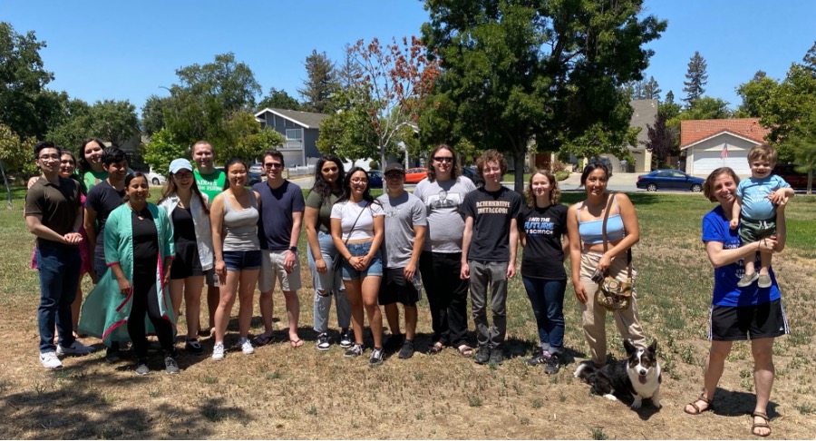 A large group of researchers come together at Houge Park