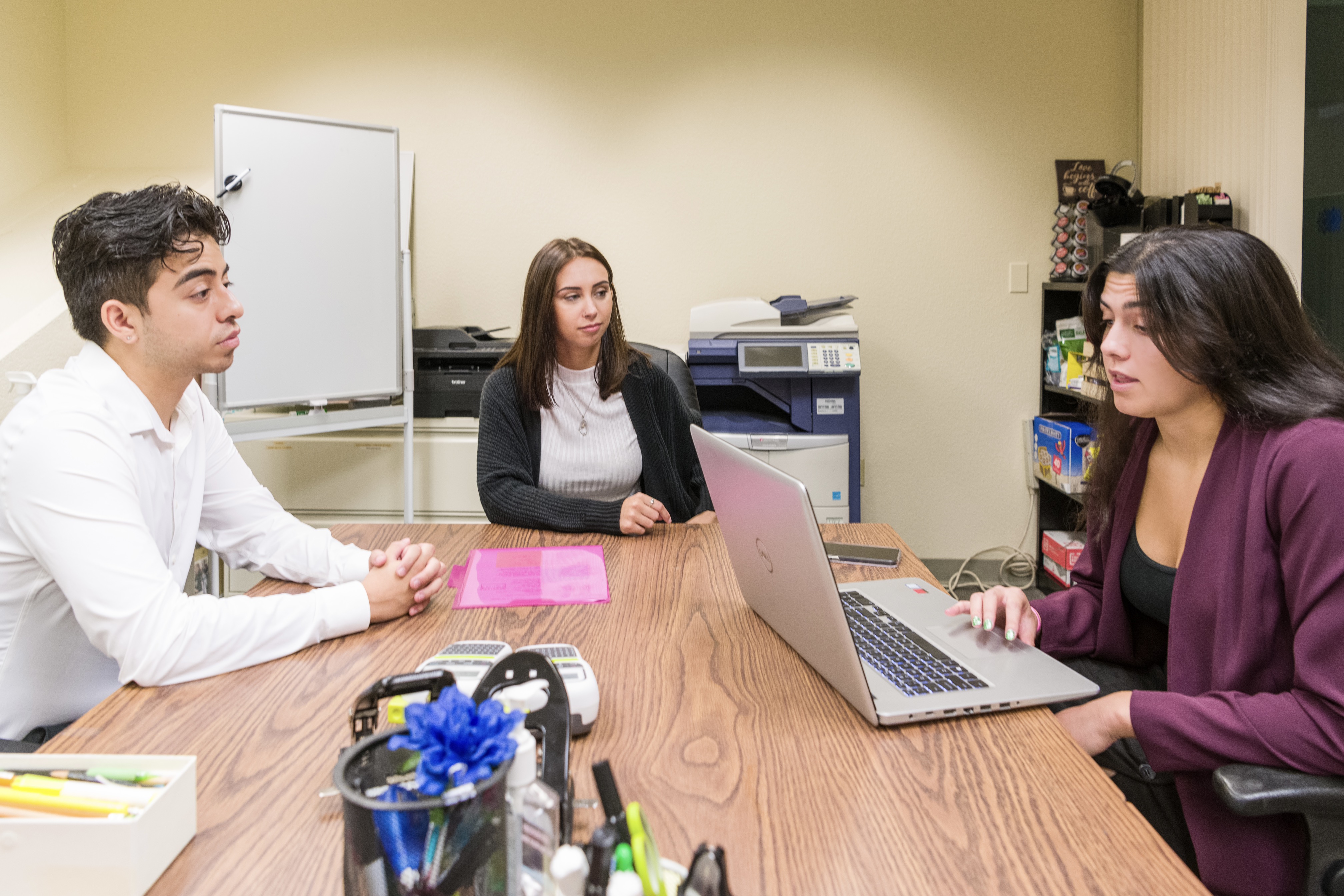 A group of students in a room with open laptops