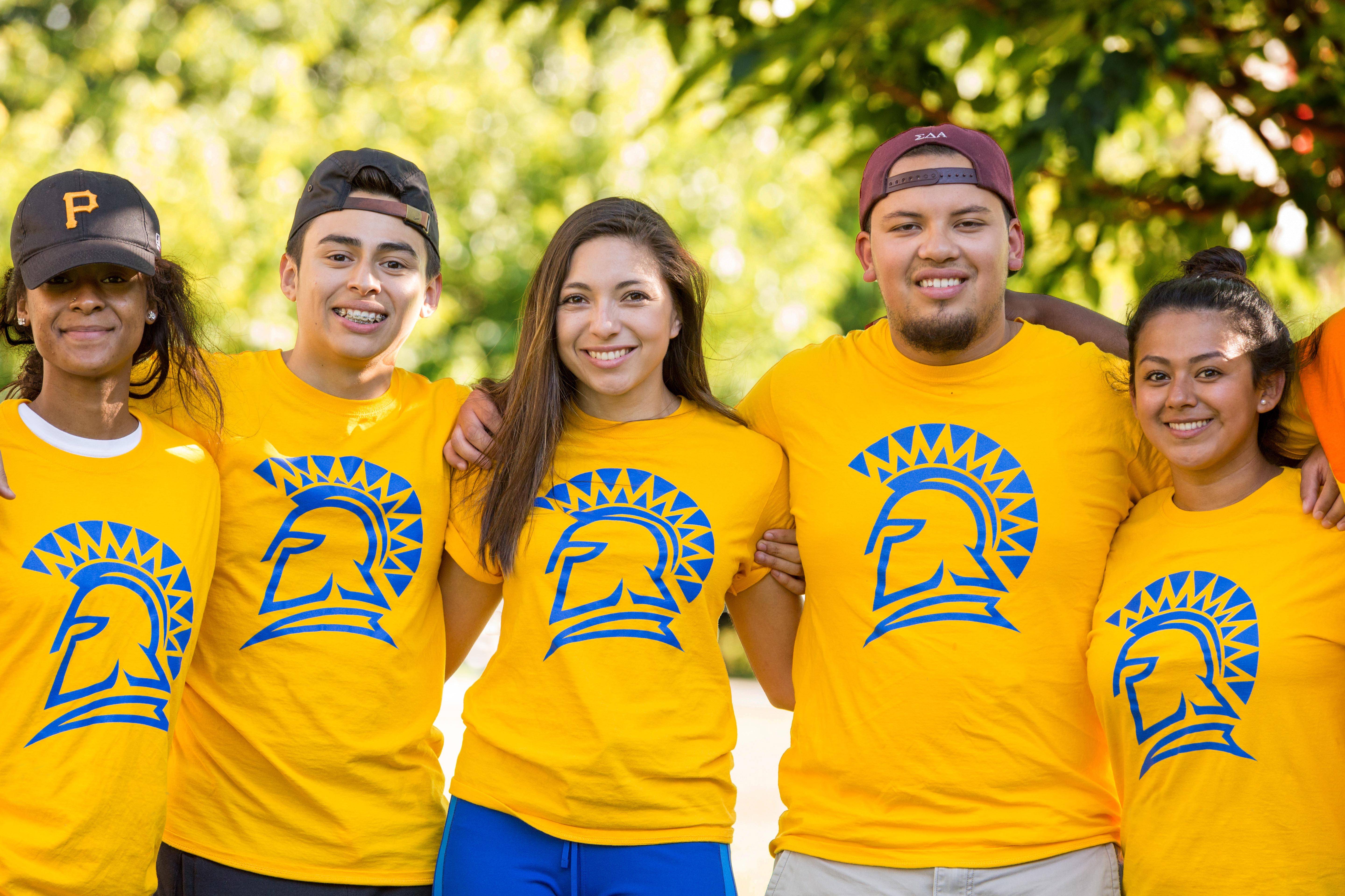 SJSU Students wearing a yellow shirt with SJSU Iogo.