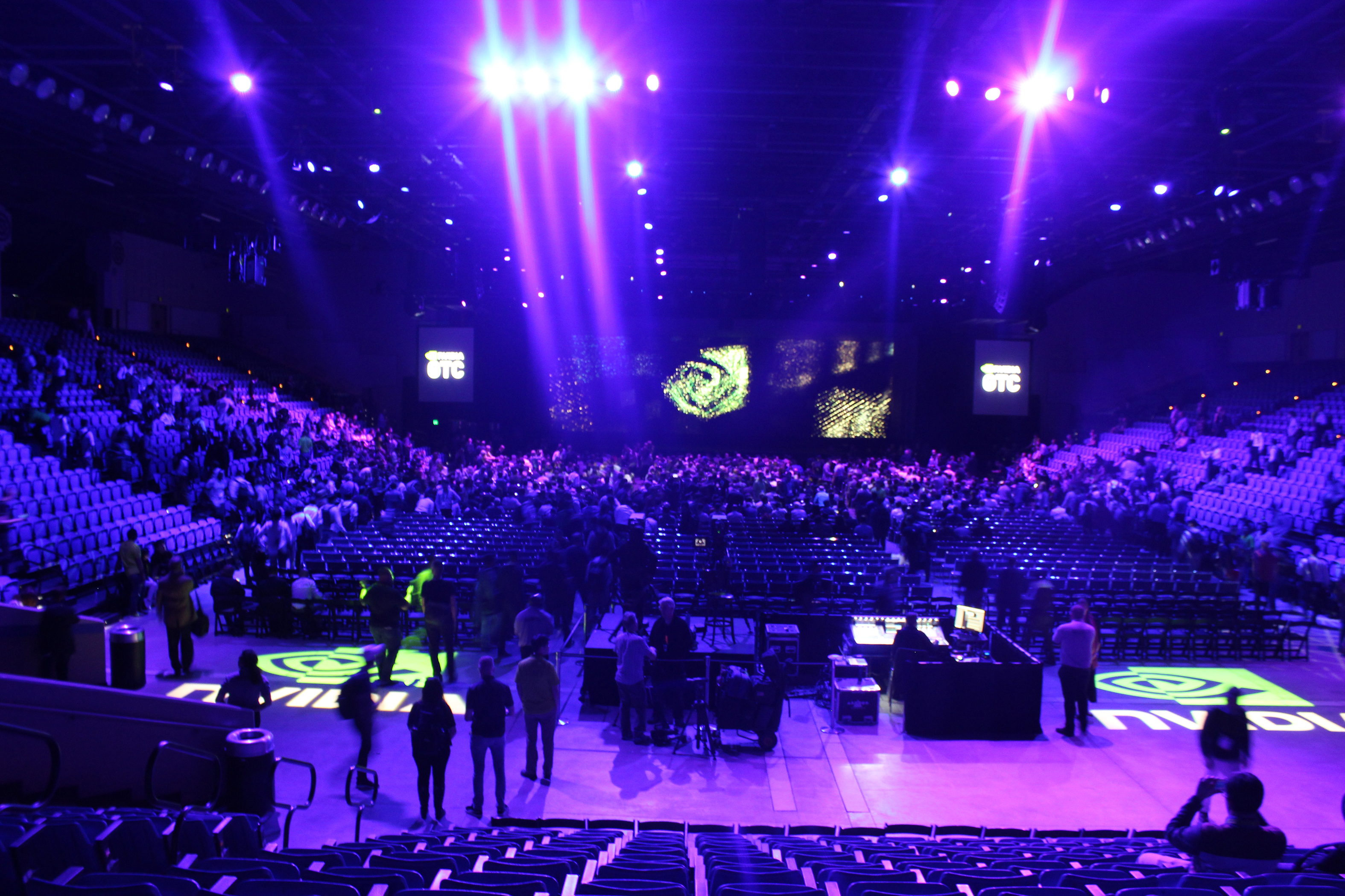 Picture of NVIDIA set up in Event Center with purple lighting and audiovisual setup.