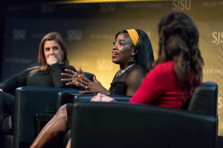 A female athlete speaks during an event.